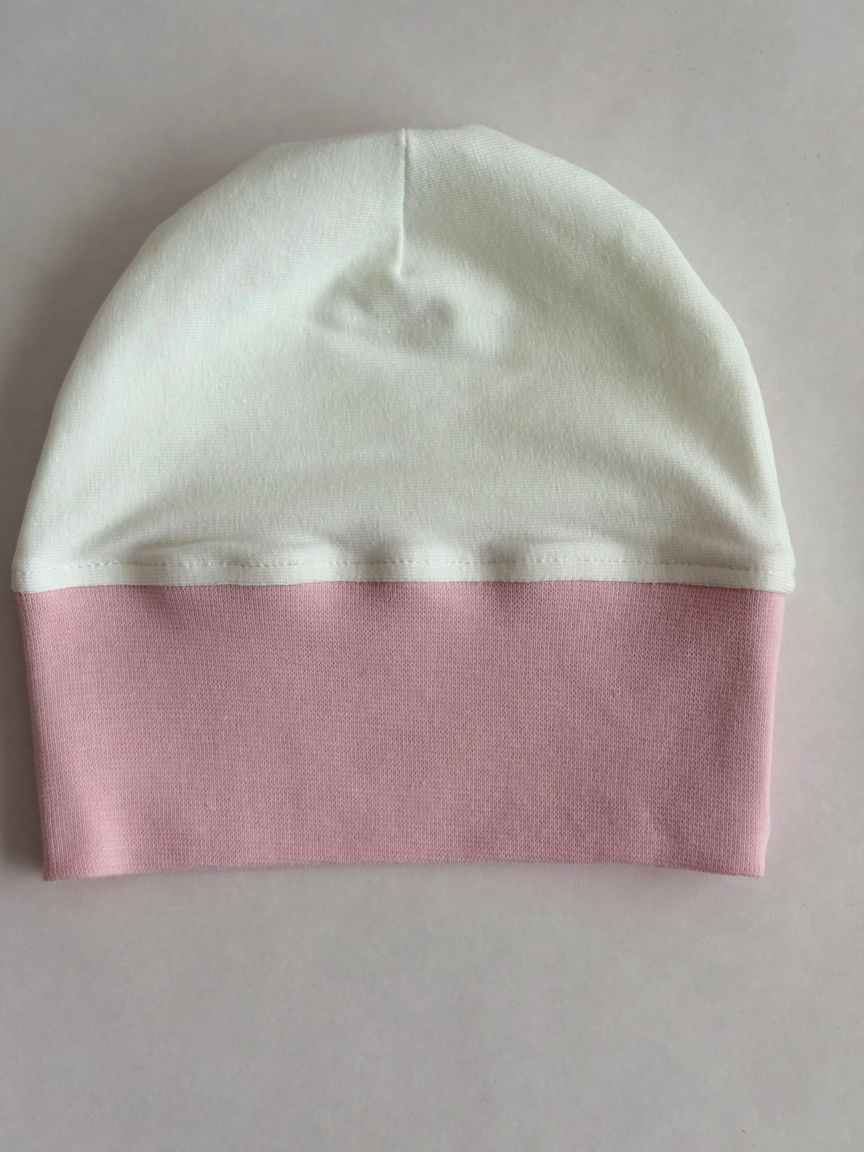 Babymössa i rosa/vit